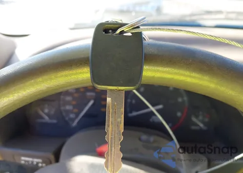 1999 Saturn Sc1 из США, поврежденный, VIN 1G8ZP1287XZ335011